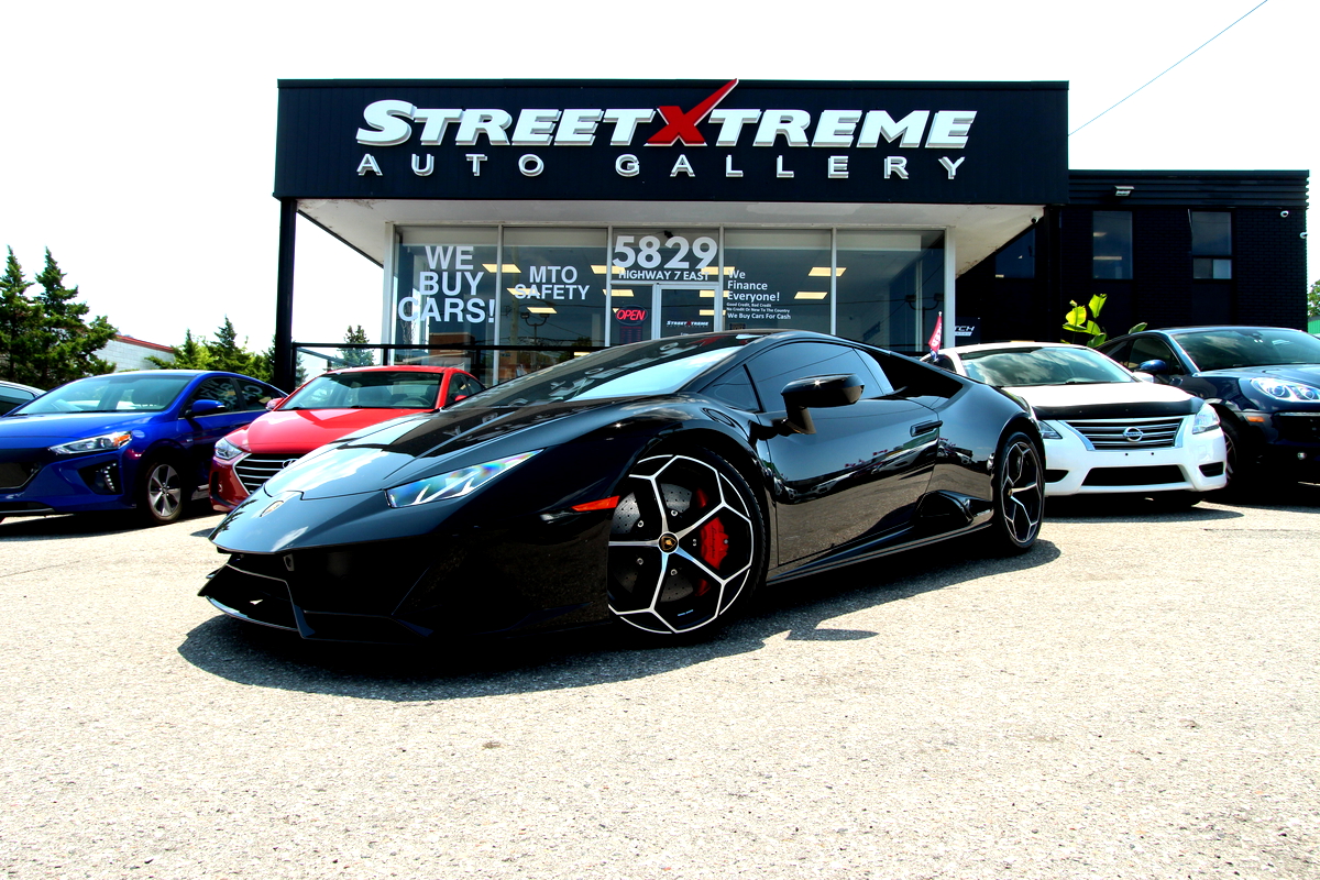 A baby blue Lamborghini huracan parked and on display at a Toronto